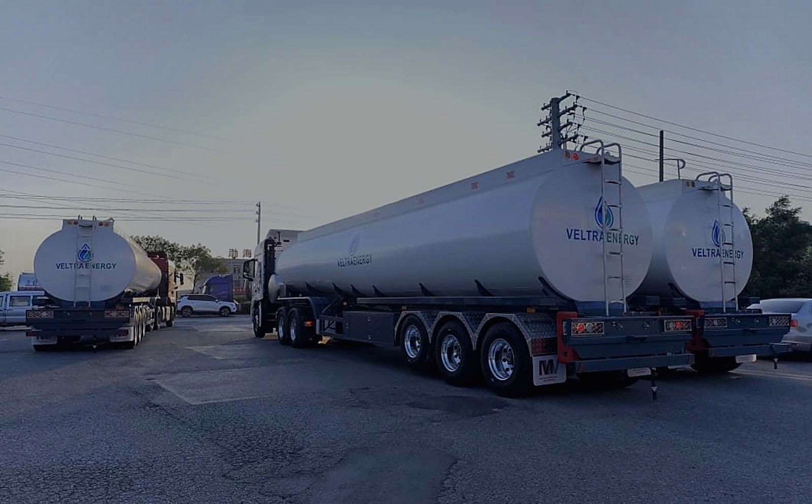 New Veltra Energy fuel tankers staged in the yard at dusk
